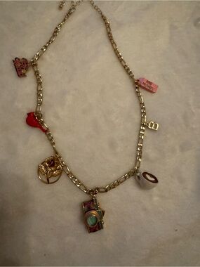 Gold Tone Charm Necklace with Pink and Red Accents
